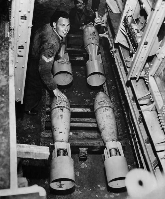 View through the bomb bay as a ground crew member loads the B-17s bomb bay