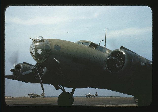 A giant of the skyways poised for flight, Langley Field, Virginia. The four powerful engines of a YB-17 bomber are warmed up before a takeoff.