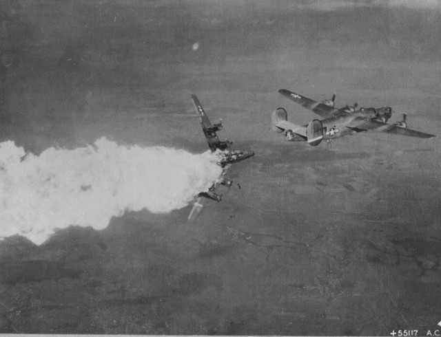B-24 hit by FLAK and explodes in mid air