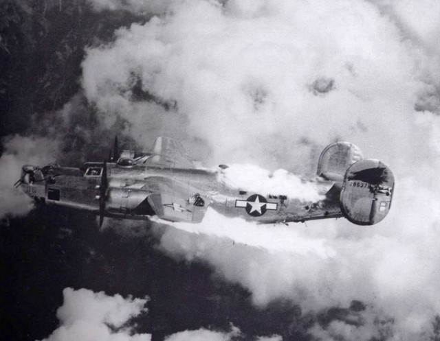 Fire spreads rapidly across a damaged B-24