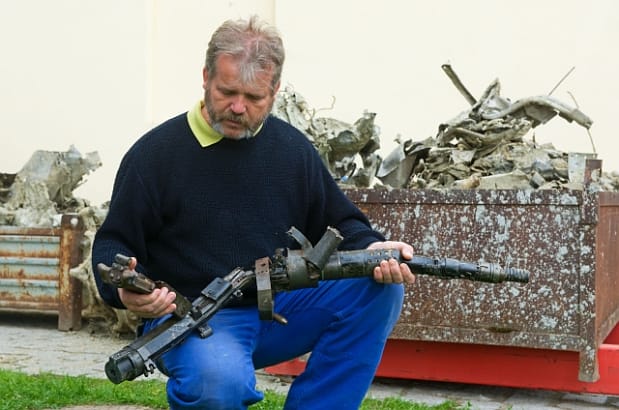 Tomáš Fedra of the Museum of Jindřichův Hrade holding parts of the wreckage.  Image by CTK.
