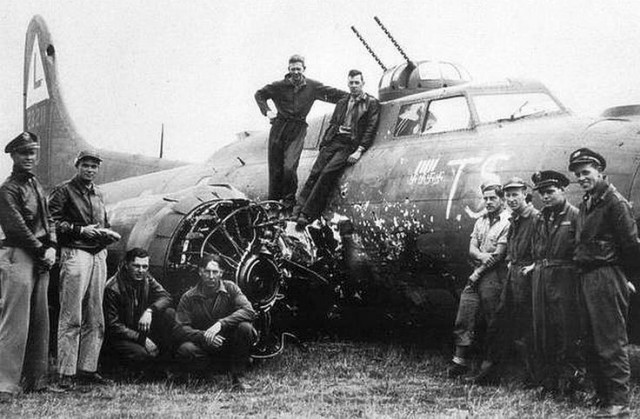 B-17 damaged in collision with Fw190 in head-on attack.