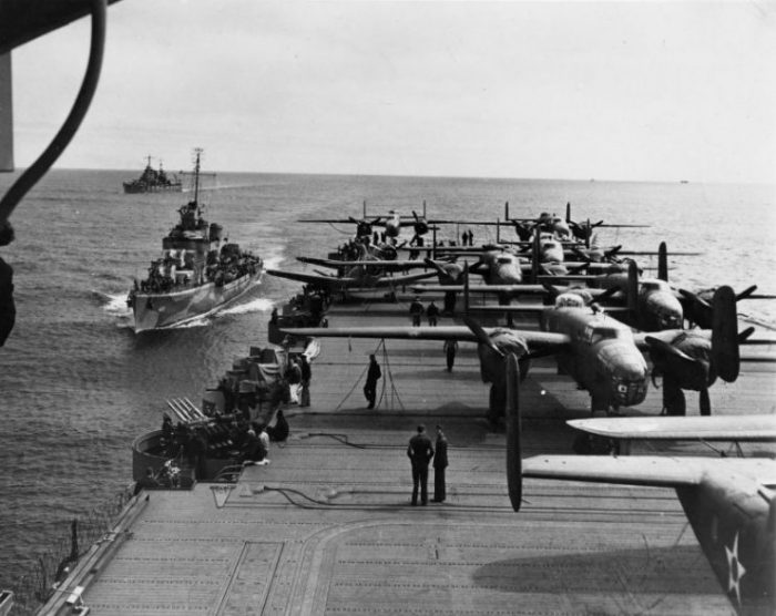 Aft flight deck of USS Hornet while en route to the launching point of the Doolittle Raid, April 1942. Note USS Gwin and USS Nashville nearby.
