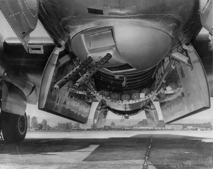 B-29 Superfortress belly turret, in front of the open bomb-bay doors.