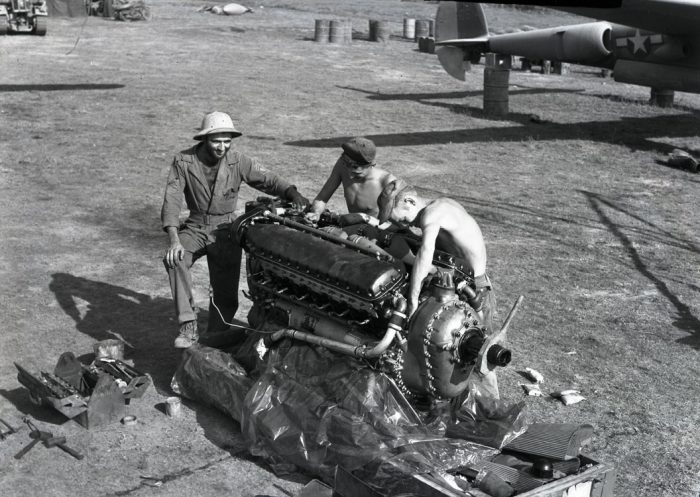Mechanics work on an Allison V-1710 V12 engine from a P-38. This engine was well liked and performed great in the P-38, but is often regarded as inferior to the Rolls-Royce Merlin.