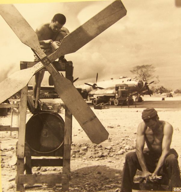 On wash day at North Field on Guam, Marianas Islands. A homemade washing machine is driven by a rotating propeller. (NARA)