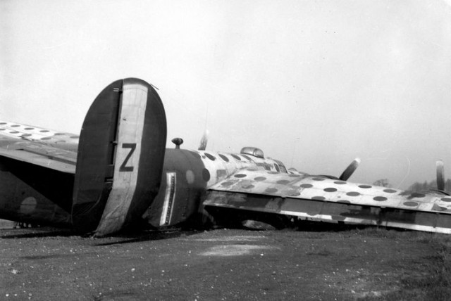 458th Bomb Group B-24 Liberator crash. This is an assembly ship. These planes were painted bright colors to assist in assembling the large bomber formations.