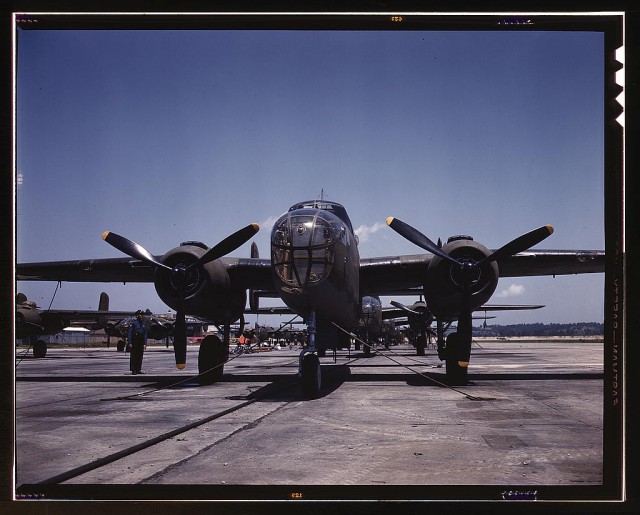 B-25 bombers on the outdoor assembly line at North American Aviation, Incorporated, almost ready for their first test flight, Kansas City, Kansas.