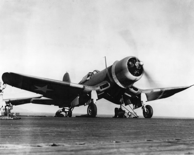 A U.S. Marine Corps Vought F4U-1 Corsair of Marine fighter squadron VMF-213 Heck Hawks is warming up for fight from the flight deck of the escort carrier USS Copahee (ACV-12), on 29 March 1943.
