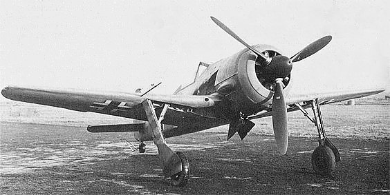 Fw 190 V5k. This is the V5 with the original small wing. The 12-blade cooling fan and redesigned undercarriage and canopy fairings are visible.