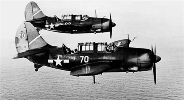 Curtiss SB2C Helldiver dive bombers in flight in 1943.
