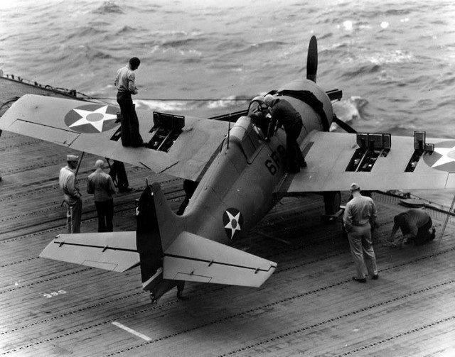 Grumman F4F-4 Wildcat fighter, of Fighting Squadron Six (VF-6) has its six .50 caliber machine guns tested on the flight deck of USS Enterprise (CV-6), 10 April 1942. Note open gun bays in the plane’s wings.