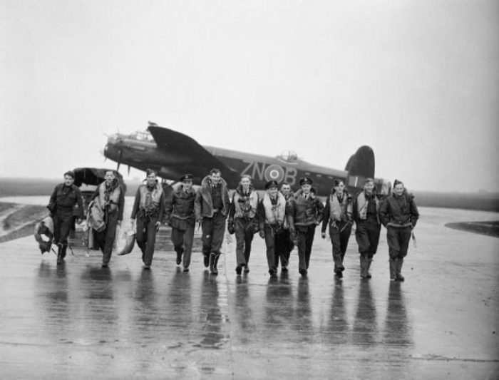 Aircrew of No. 106 Squadron photographed in front of a Lancaster at Syerston, Nottinghamshire.