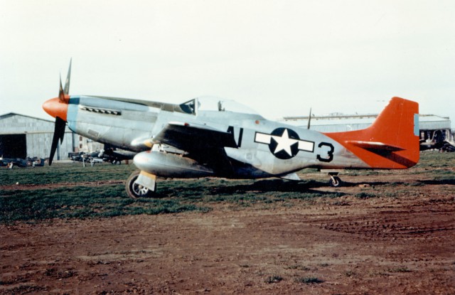 P-51D of the 99th Fighter Squadron, 332nd Fighter Group shows off it distinctive red tail, probably at Ramitelli Airfield, Italy, 1944-45.