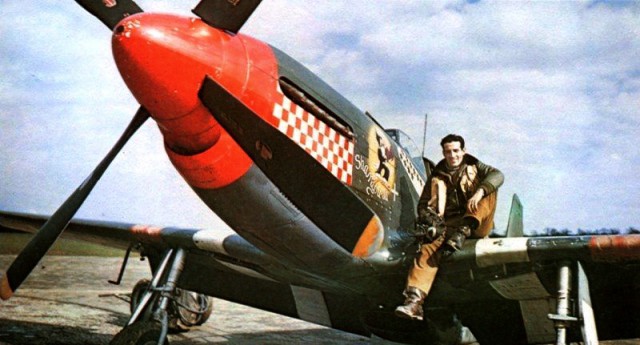 USAAF Capt Don Gentile sits on the wing of his P-51B Mustang “Shangri-La” of the 336th Fighter Squadron at RAF Debden, Essex, England, UK; 1944-45.