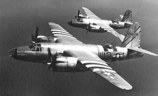 Two B-26 Marauders carrying invasion stripes.